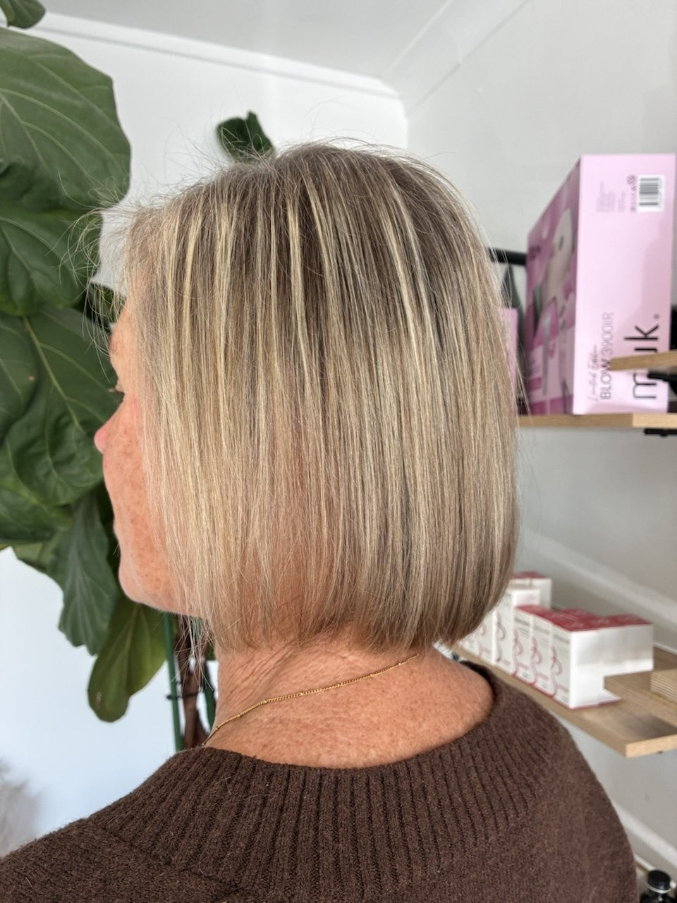 After hair transformation showing a fresh blonde bob