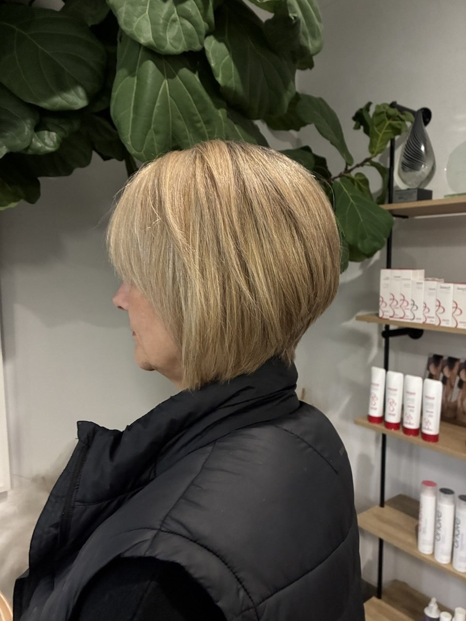 After hair transformation showing a neat blonde bob